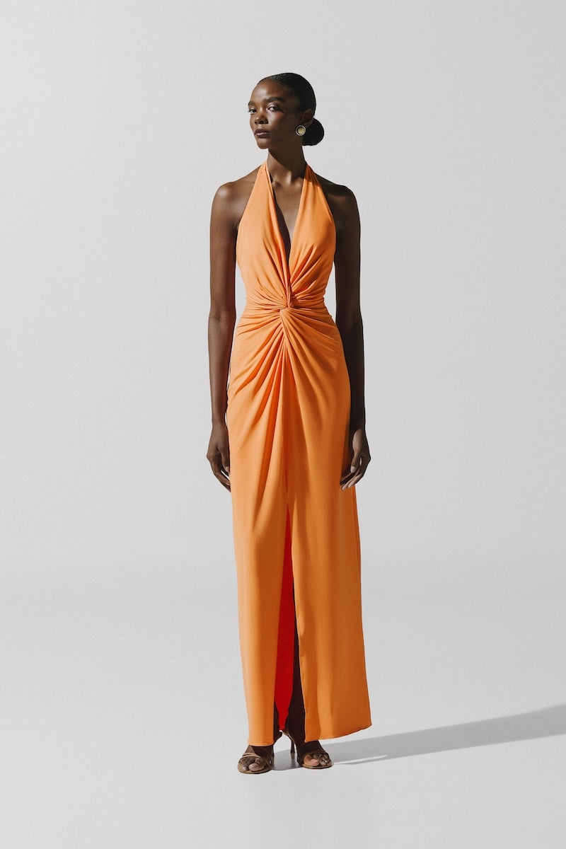 Baobab Eleonora maxi dress in caqui, flowing fabric with a relaxed fit, showcased on a model in a full-length view.