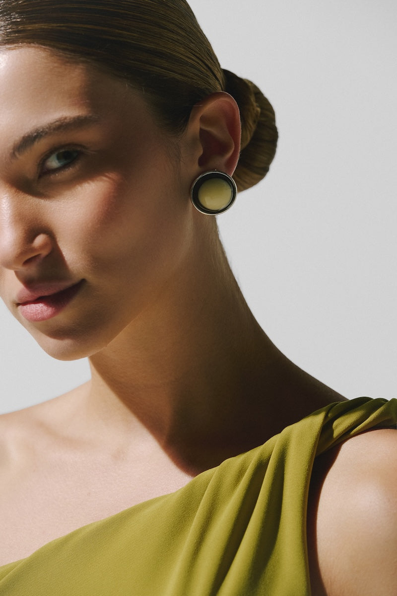 Baobab Celéle maxi dress in Limoncello color, flowing fabric, sleeveless design, and elegant silhouette on a model.