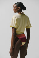 Light beige Baobab TIKA T-shirt in Crema Italiana with a casual fit, displayed on a white background.