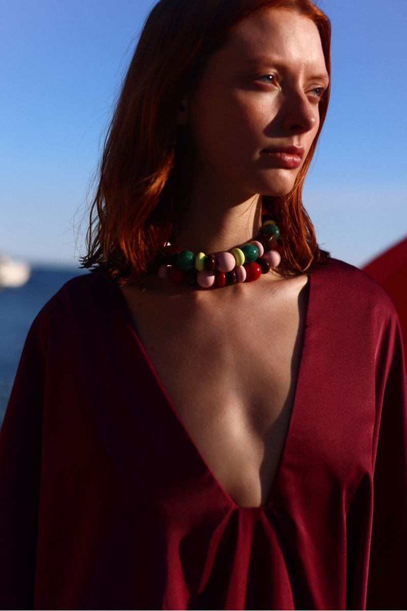 Baobab Pietro mini dress in Amarena color, featuring a stylish sleeveless design and flowy fabric for a chic summer look.