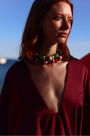 Baobab Pietro mini dress in Amarena color, featuring a stylish sleeveless design and flowy fabric for a chic summer look.