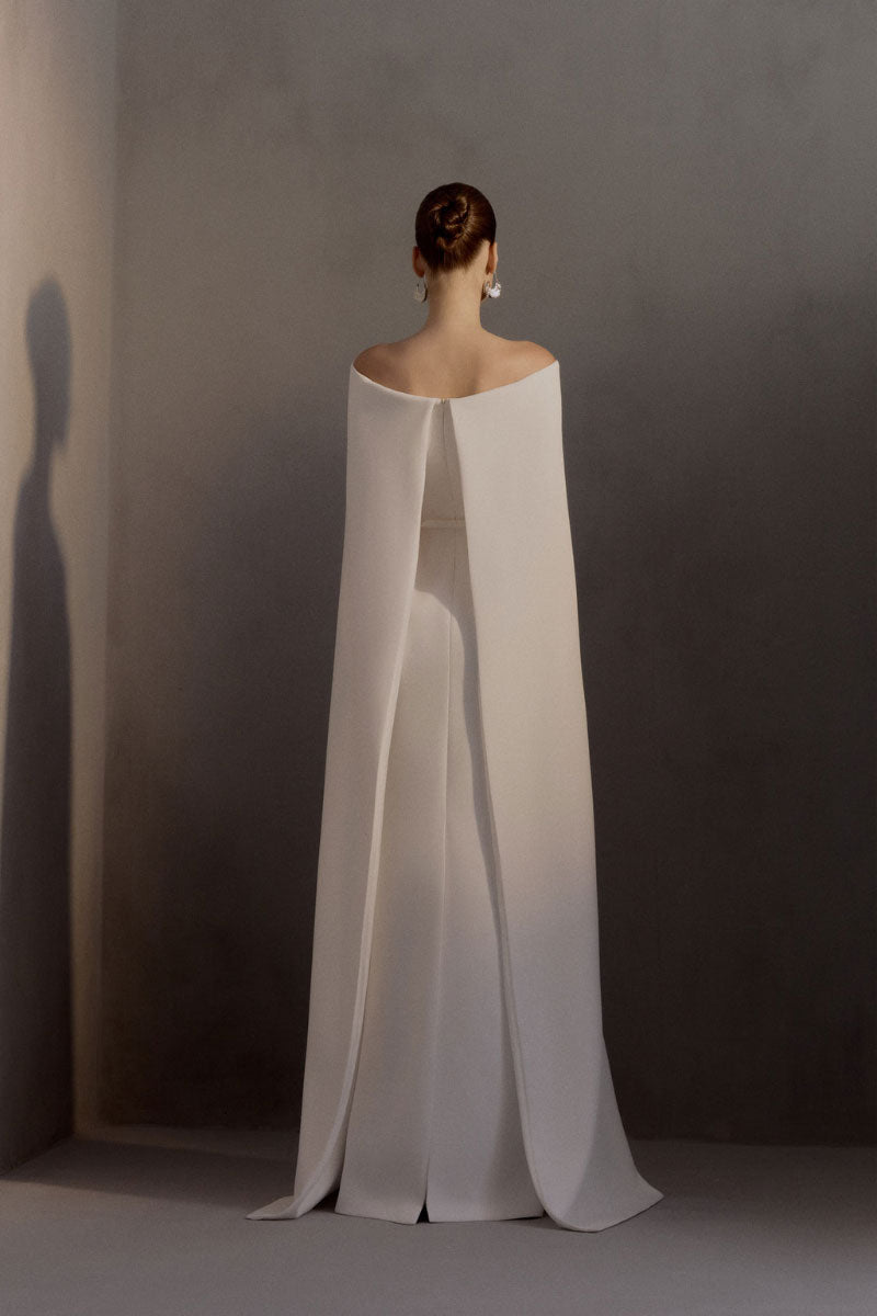White Plan Legacy gown featuring elegant design with flowing fabric, perfect for formal occasions and special events.