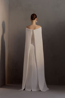 White Plan Legacy gown featuring elegant design with flowing fabric, perfect for formal occasions and special events.
