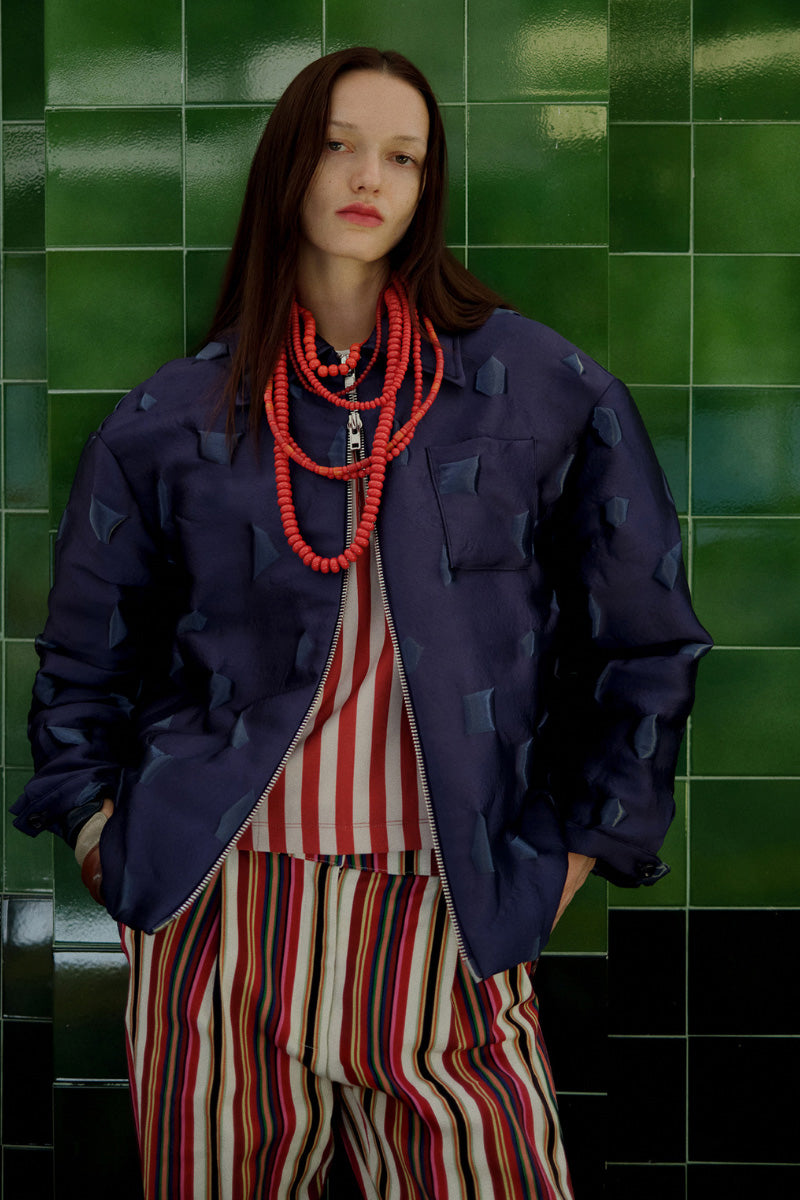Purple textured puffer jacket by ColoReve, featuring quilted design and cozy insulation for cold weather.
