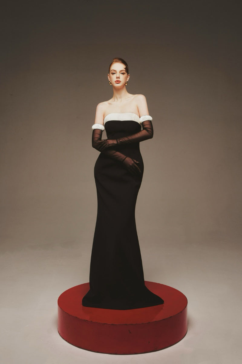 Elegant black Vesper evening gown by Margée Atelier, flowing maxi dress with intricate lace details and a sophisticated silhouette.