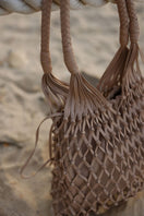Adriana Castro nude leather shoulder bag from LA RED LEATHER collection, featuring soft textured leather and sleek design.