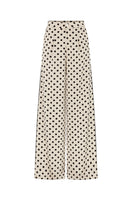 Valenciani loose fit cream trousers with relaxed fit and wide-leg style, shown on a model.