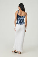 White Pierre maxi skirt by Summer Away featuring flowing fabric and a stylish, elegant design perfect for summer wear.