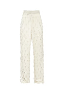 White beaded pants by Onalaja featuring intricate beadwork and a stylish, modern design.