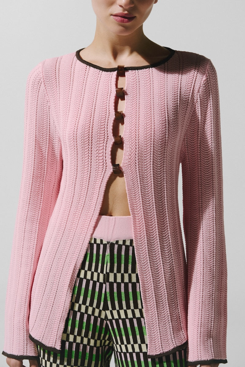 Baobab Corsica top in Vita Rosa, stylish sleeveless blouse with a relaxed fit, vibrant pink color, and lightweight fabric.