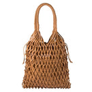 Tan La Red Leather shoulder bag by Adriana Castro featuring a sleek, modern design with shoulder strap and smooth leather finish.