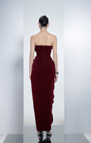 Red velvet V-neck petal strapless gown by Happy Clothing, featuring a flowing silhouette and elegant design.