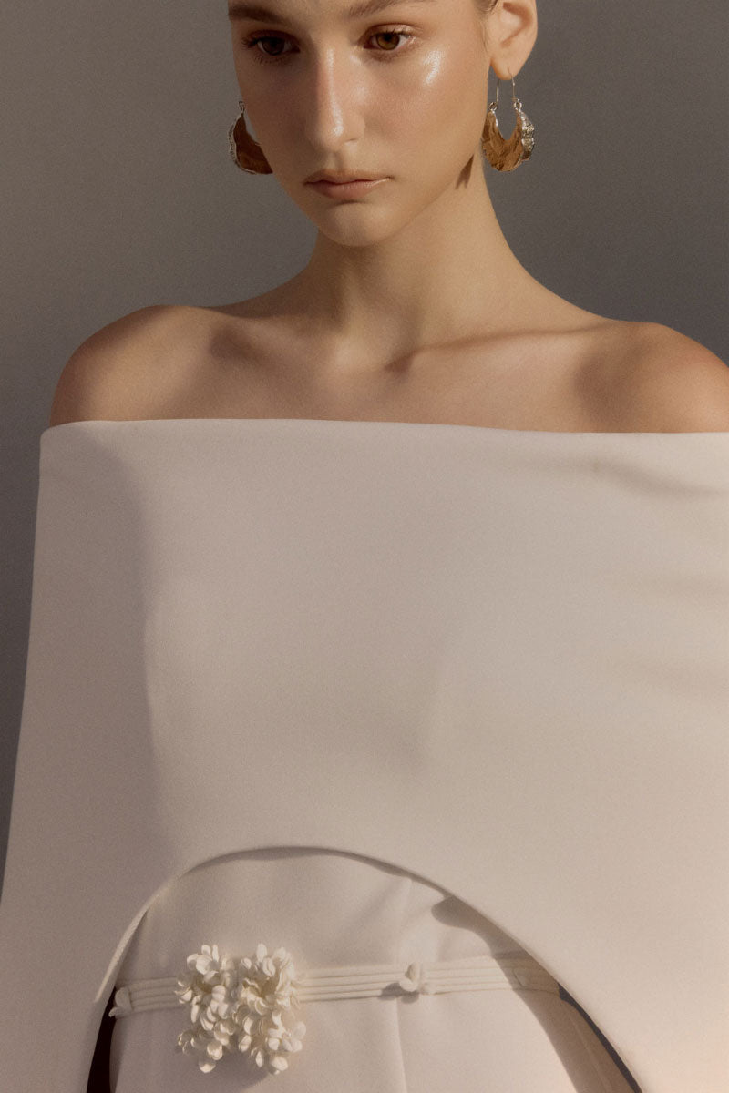 White Plan Legacy Dress gown with elegant design, flowing fabric, and intricate detailing, perfect for formal occasions.