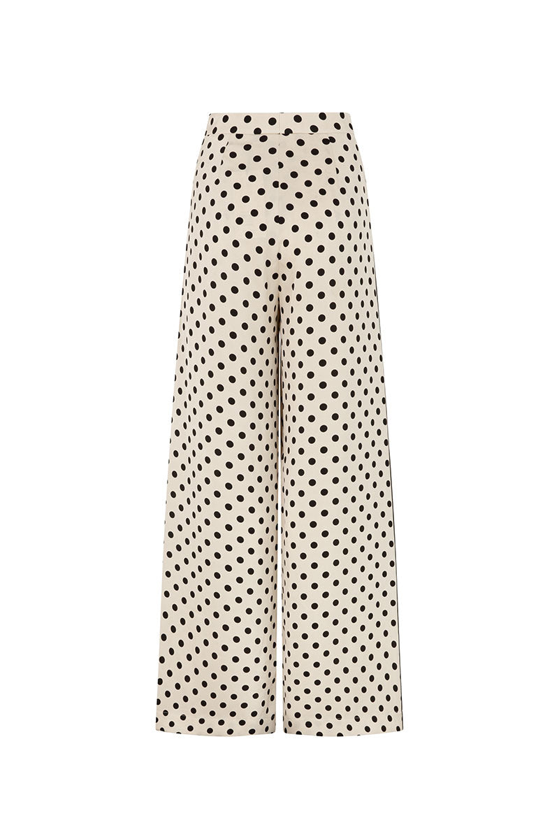 Cream loose fit trousers by Valenciani, featuring a relaxed style and soft fabric, perfect for casual and comfortable wear.