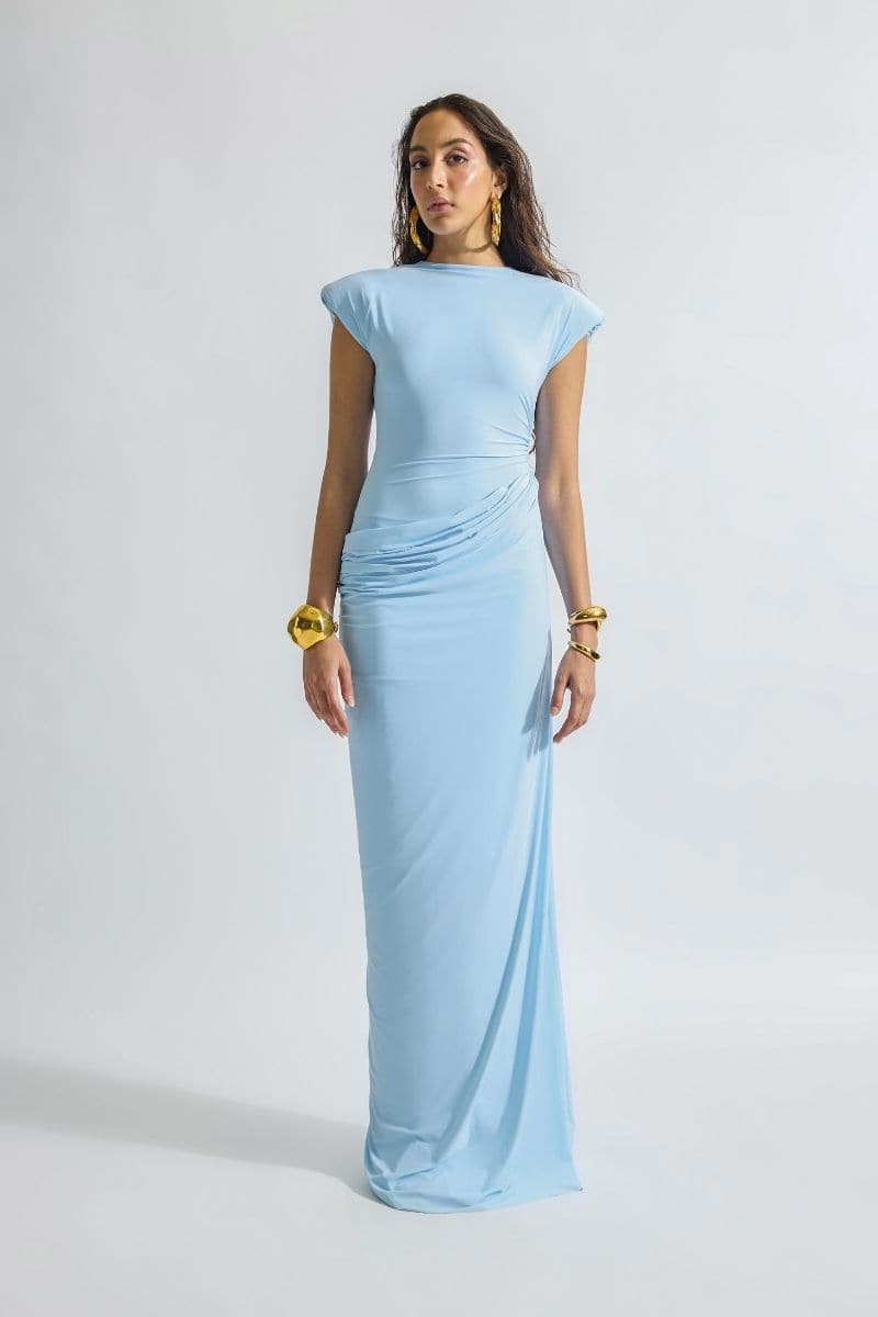 Deme by Gabriella CULT MIA X DEME maxi dress in flowing fabric with floral print and sleeveless design on a model.