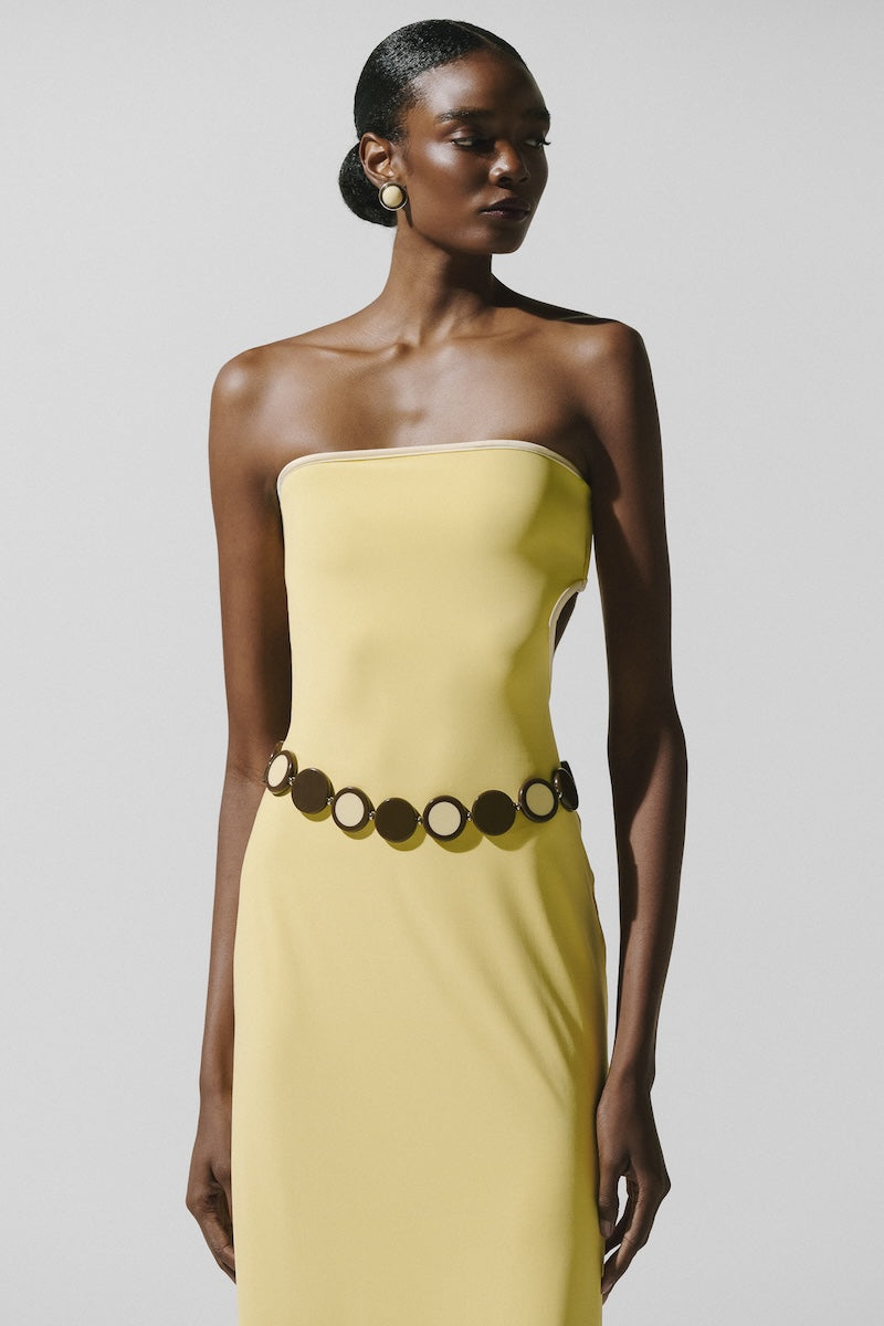 Baobab Mambo Maxi Dress in light yellow with flowing fabric and sleeveless design, perfect for casual or summer wear.