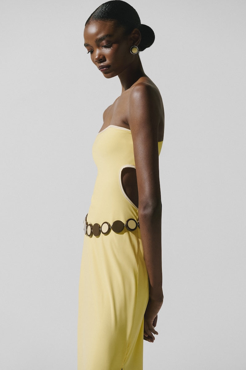 Bright yellow Baobab Mambo Maxi Dress featuring flowing fabric and elegant design, perfect for summer or casual wear.