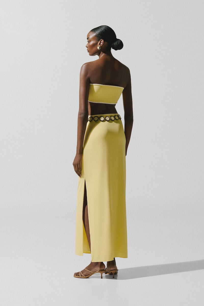 Baobab Mambo Maxi Dress in light yellow with flowing fabric, sleeveless design, perfect for summer or casual wear.