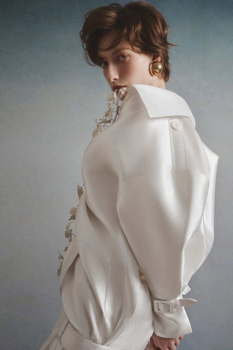 White Plan Valeria belted coat, stylish winter outerwear with a belt, in a neutral color, displayed on a hanger.
