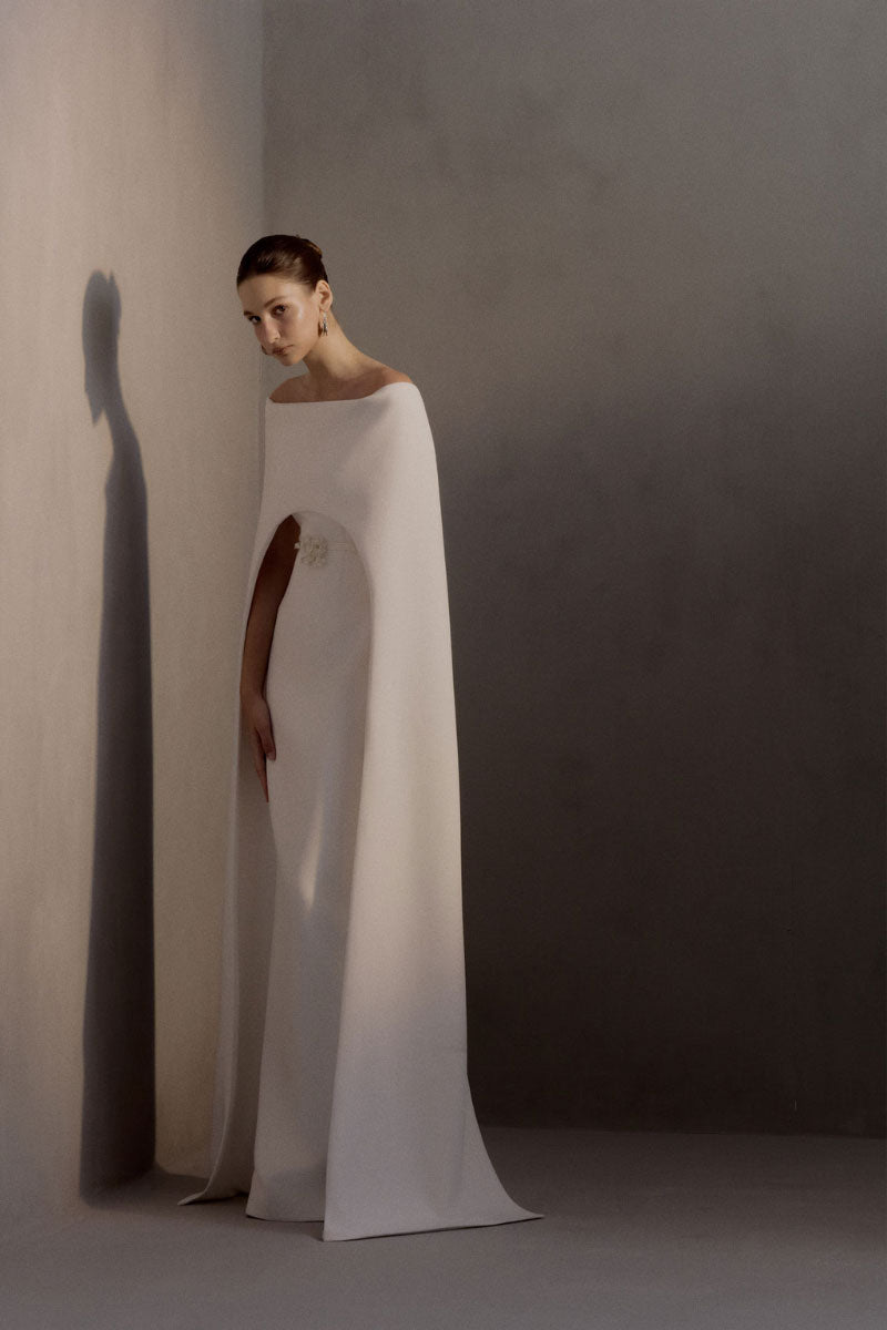 White Plan Legacy Dress gown, elegant white formal gown with flowing fabric and sophisticated design.