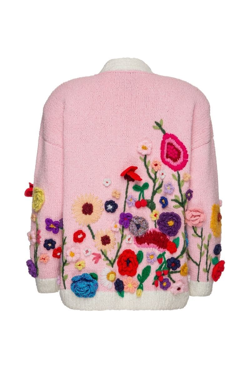 Lalo Floris pink embroidered oversized cardigan with floral embroidery, cozy knit, and relaxed fit, displayed on a hanger.