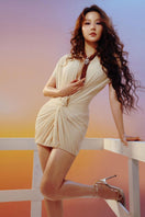 CEM draped cutout mini dress in black with asymmetrical design and stylish cutout details, perfect for fashionable occasions.