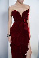 Red velvet strapless gown with V-neck and petal accents by Happy Clothing, showcased on a mannequin.