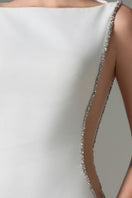 Elegant Fatima Crepe Cut-Out Gown by 21Six featuring a flowing silhouette and stylish cut-outs, showcased on a model.