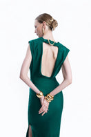 LEDIEL MOCCA LARGO emerald gown with flowing fabric and elegant design, showcased on a model in a stylish setting.
