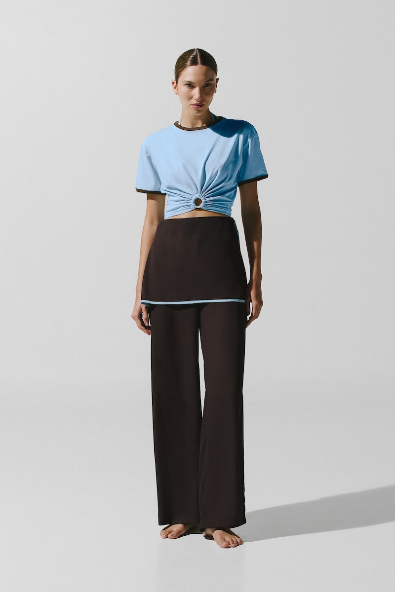 Baobab TIKA T-shirt in Blu Moca, a casual shirt with a soft fabric and stylish blue color, displayed on a flat surface.