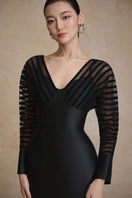 Arti Apparel Tracy gown with elegant flowing fabric and intricate detailing, showcased on a model.
