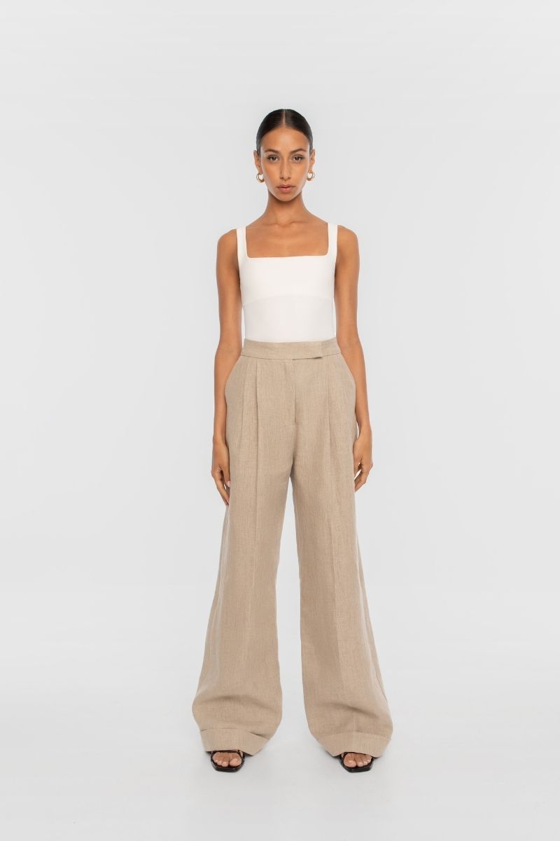 Dāl the Label linen wide-leg pants in a light, breathable fabric with a relaxed fit and high waist.