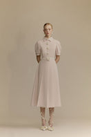 White Plan Quincy midi dress with a flowing silhouette, featuring elegant fabric and stylish design.