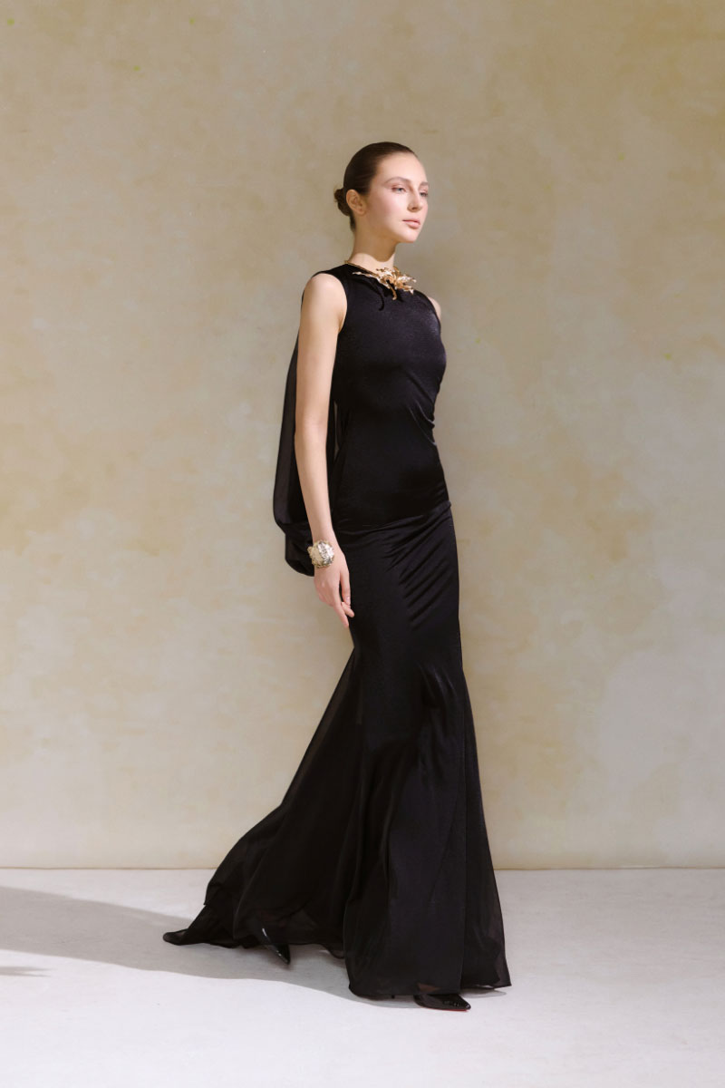 Arti Apparel Calla Maxi Dress featuring a flowy silhouette, elegant design, and vibrant floral pattern in a full-length dress.