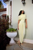 Deme By Gabriella Penelope yellow maxi dress with flowing fabric and sleeveless design, perfect for summer occasions.