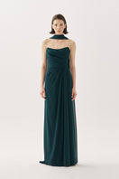 Elegant forest green Tarık Ediz gown with flowing fabric and intricate detailing, perfect for formal occasions.