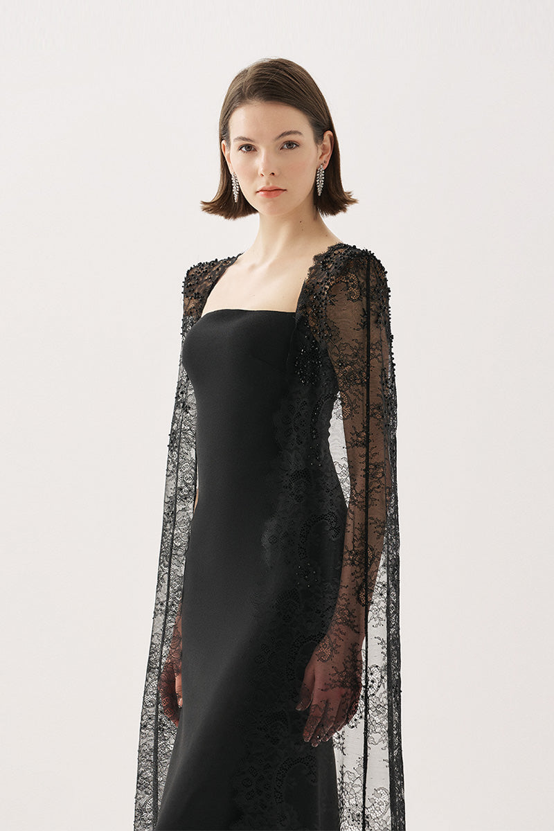 Black Tarık Ediz maxi dress from the BELANIS collection, featuring elegant flowing fabric and a stylish design.
