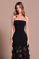 Black Wisteria gown by Tarık Ediz featuring elegant fabric, intricate design details, and a flowing silhouette.