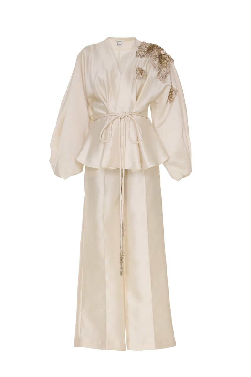 Tarık Ediz MADDIE vanilla co-ords set displayed on a ghost mannequin, featuring a stylish top and matching pants.