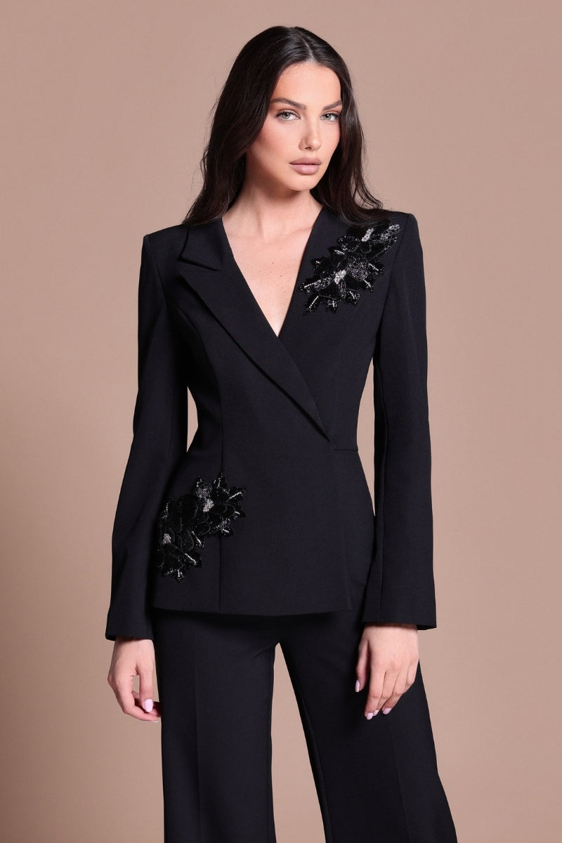 Black Tarık Ediz IRENI jumpsuit featuring stylish tailored design and elegant fit, shown in the product image.