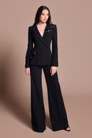 Black Tarık Ediz IRENI jumpsuit shown from the front with a sleek, fitted design and elegant neckline.