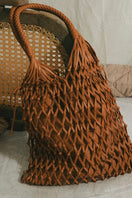 Tan leather shoulder bag by Adriana Castro from La Red Leather collection, featuring a sleek design and shoulder strap.