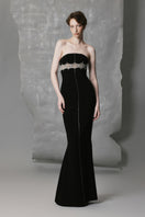 Black straight long gown with intricate bead detailing by Phan Huy, featuring a fitted silhouette and elegant design.