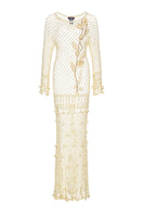 Andreeva handmade butter yellow vanilla crochet maxi dress displayed on a hanger with intricate crochet details.