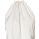Baobab Lorena top in Mascarpone color shown on a model, featuring a stylish sleeveless design and soft fabric for a chic look.