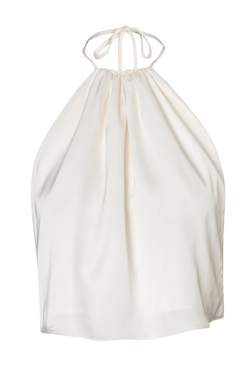 Baobab Lorena top in Mascarpone color shown on a model, featuring a stylish sleeveless design and soft fabric for a chic look.