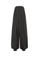 Black Valenciani jumpsuit featuring a sleek, fitted design with long sleeves and a stylish, modern silhouette.