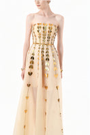 Elegant champagne metallic gown with heart embellishments by Happy Clothing, featuring a flowing design and shimmering fabric.