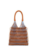 Blue and tan leather and suede shoulder bag by Adriana Castro featuring a stylish design and adjustable strap.