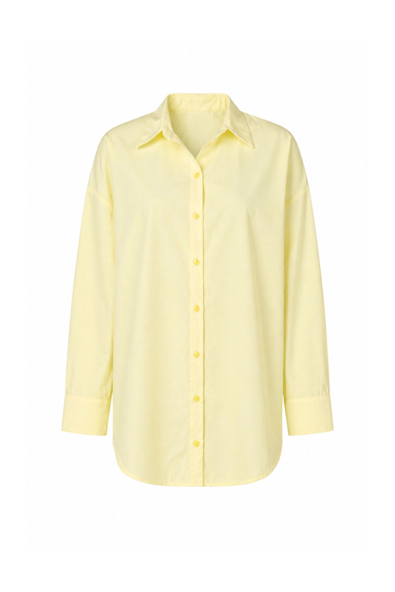 Baobab Wayra shirt in Limone color, lightweight cotton with a relaxed fit and button-down front, displayed on a hanger.